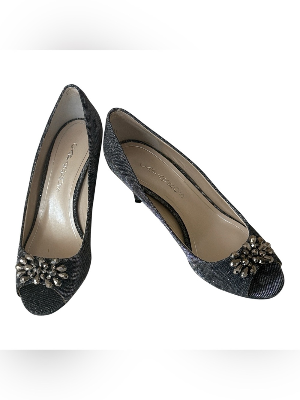 Caparros peep-toe heels feature a silver gray finish w/crystal brooch, size 9.5